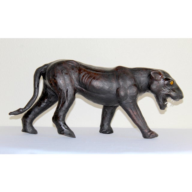Rare and exceptional example of mid-century British craftsmanship, this vintage handcrafted black leather panther...