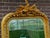 A refined 1980s French Louis XVI–style full-length floor mirror, designed with an elegant vertical silhouette, warm...