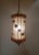 An original and unusual lantern style hanging fixture characterized by open work butterfly wings resulting in a pierced,...