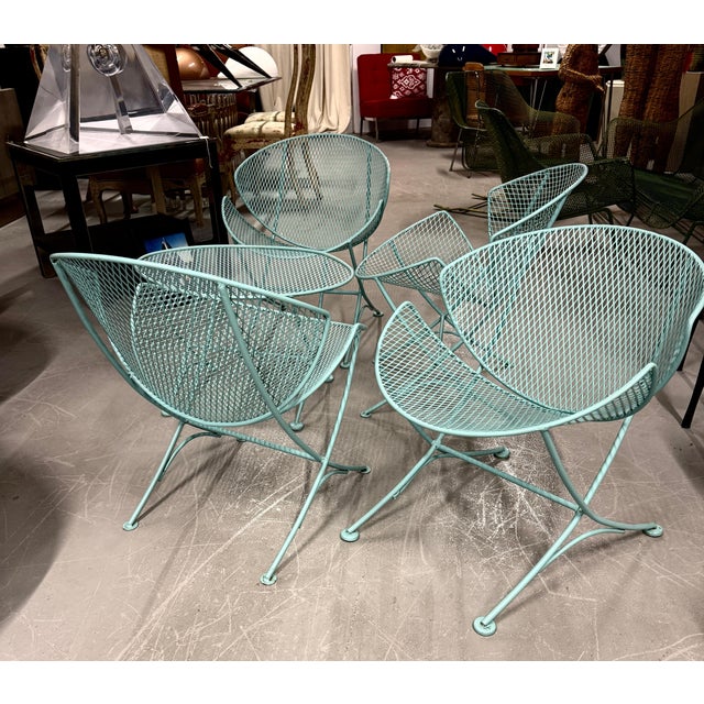 a lovely set of 4 clamshell or orange slice chairs designed by Mauricio Tempestini for Salterini. This set was likely...