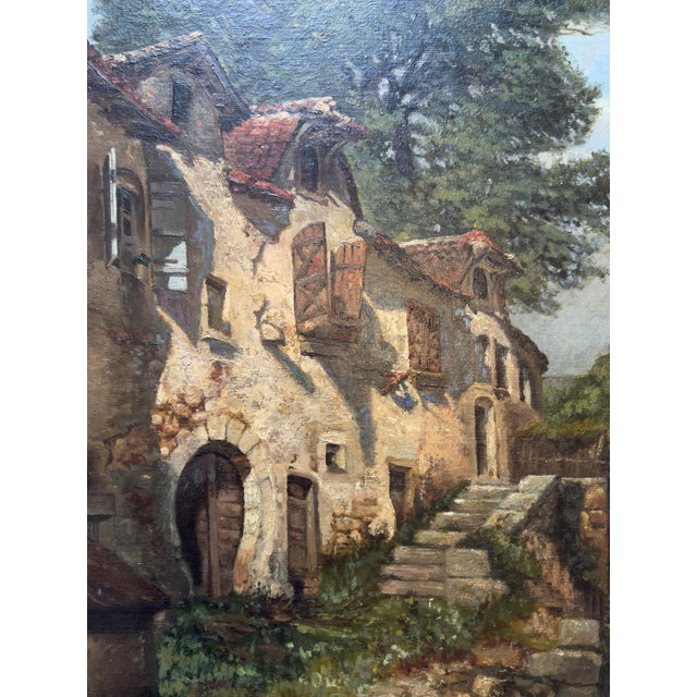 A striking large-scale 19th-century French oil painting depicting a picturesque group of historic stone houses in...