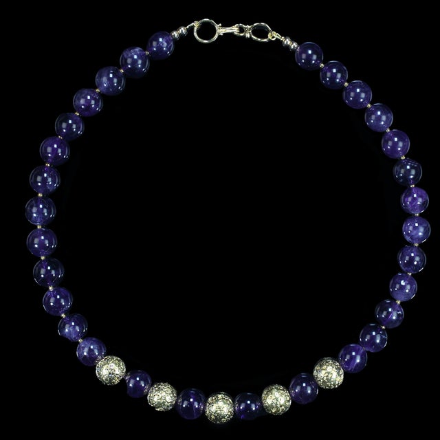 This elegant 19-inch amethyst necklace is a timeless accessory designed to take you effortlessly from day to evening wear....