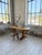 Antique pine table with an oval top and a brutalist-inspired base. we love the beautiful contrast between the curves of...