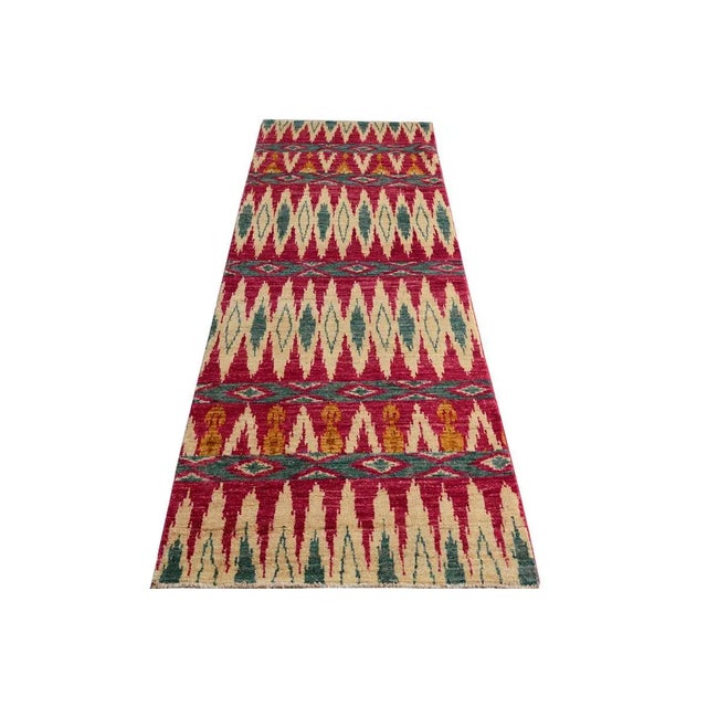 Add a splash of color with this dazzling transitional runner, hand knotted in an all over artful intricate pattern and a...