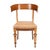 An Austrian Biedermeier klismos side chair from around 1830, its curved beechwood frame finished in a warm honey-brown...