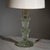 Table lamp in clear glass with enclosed air bubbles. The composition is formed by three-tiered, flower-shaped elements...