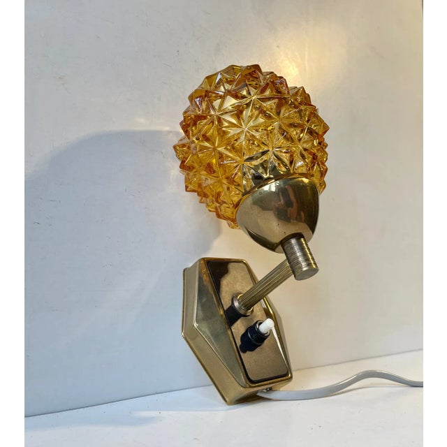 Stylish wall light manufactured and designed by j. Sommer in denmark during the early 1960s. Its made from partially...