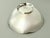 A Tiffany & Co. 925 sterling silver candy or nut bowl in a modern, simple design with a scalloped edge. Engraved at the...
