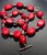 This is a very notable necklace, the vibrant red bamboo coral are of significant size. Interspersed between these are...