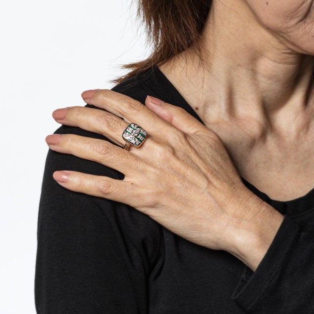 Finely detailed vintage Art Deco diamond & emerald ring (circa 1920s to 1930s) crafted in 14k white gold. Center set old...