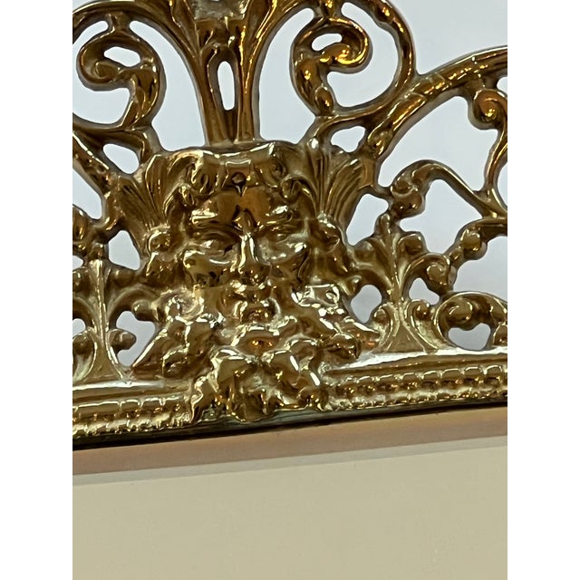 Beautiful and rare pair of mirrored brass candleholder sconces. Made by Virginia Metalworks.