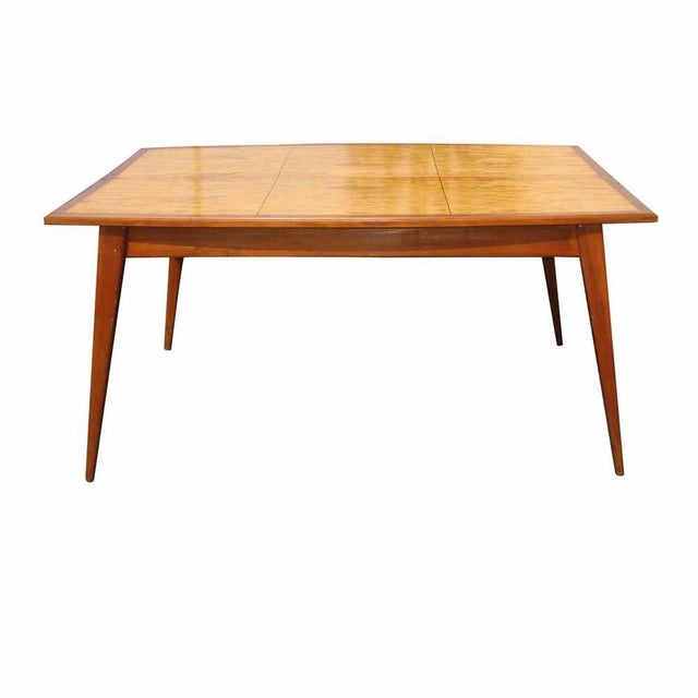 Space saving burled wood top table that can fold down into a desk configuration. Spayed legs. Extended 62" W x 42" D x...