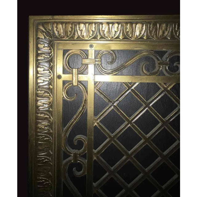 Early 20th Century bronze grille from the Metropolitan Museum of Art in NYC having egg and dart frame with inner scroll...