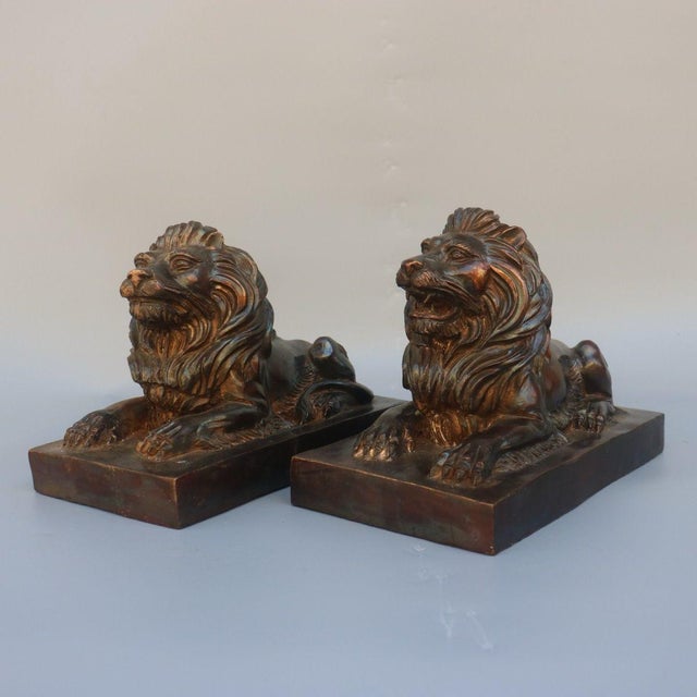 This distinguished pair of brass recumbent lions brings a classic, stately presence to any interior. Each lion is finely...