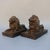 This distinguished pair of brass recumbent lions brings a classic, stately presence to any interior. Each lion is finely...