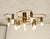 Designer ceiling lamp Designer ceiling lamp made around 1970. Twelve lights. Curved brass tubes, burnished sockets. The...