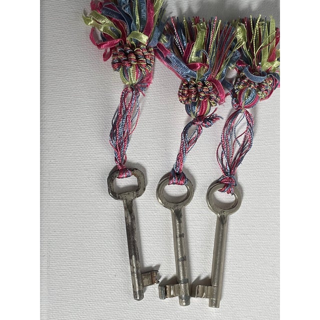 Nice set of 3 antique skeleton keys with multicolor tassels.
