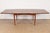 An exceptional Mid-Century Modern walnut boat-shaped extension dining table In the manner of Gio Ponti USA, 1960s...