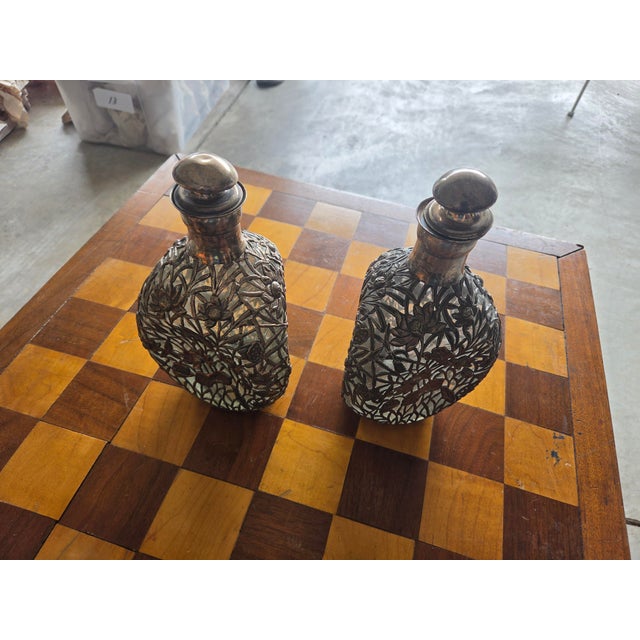 Haig whiskey pinch bottles. They have a beautiful silver plate overlay