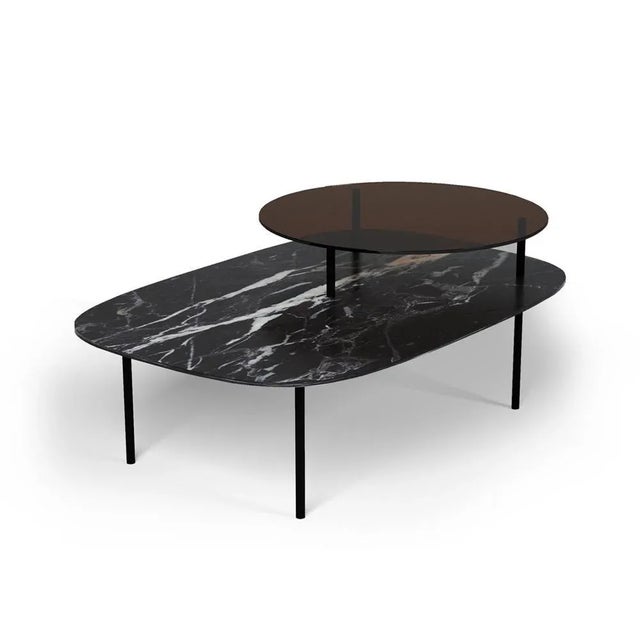 Linda side table by collector designer: davide monopoli materials: table top in smoked glass and nero marquina marble....