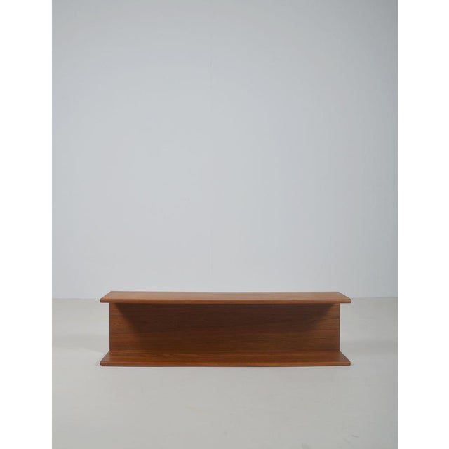 Danish wall shelf from the 1970s crafted from solid teak. Thanks to its airy and floating design, this wall shelf fits...
