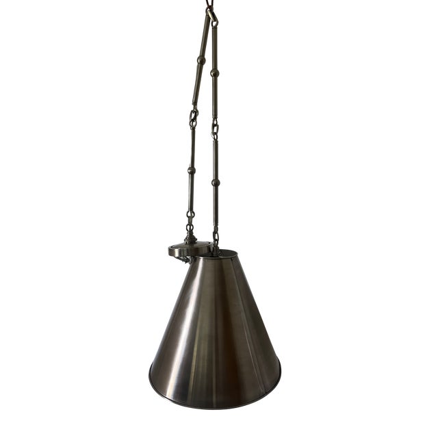 Elegant and understated, the Goodman Small Hanging Light by Thomas O'Brien for Visual Comfort (TOB 5090AN-AN) features a...