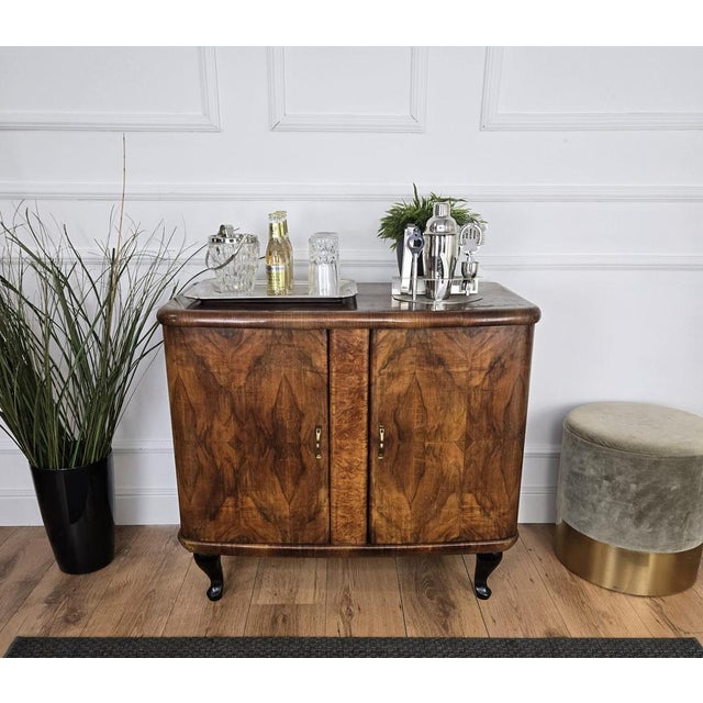 Very elegant Italian Art Deco Mid-Century Modern dry bar cabinet, in beautiful veneer walnut briar burl wood, two doors...