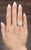 A captivating 2.0-carat diamond commands attention at the center, showcasing a white hue with VS1/VS2 clarity and a J/K...