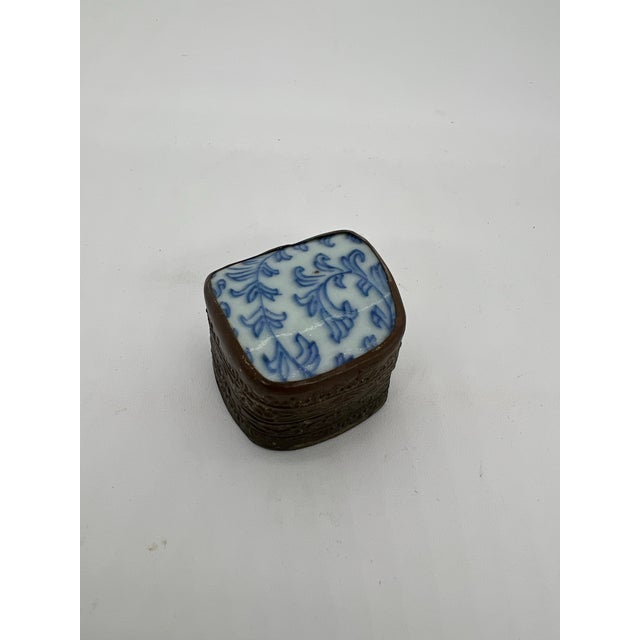 Unique Chinese trinket box made of porcelain and metal. The top of the box is a piece of porcelain from an antique vase...