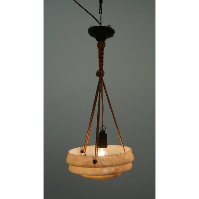 Offered is this beautiful vintage soft pink marbled glass Art Deco design pendant lamp. If you want to emphasize your own...