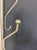 A striking mid-century modern coat and hat rack in brushed satin aluminum, featuring an asymmetrical branch-form...