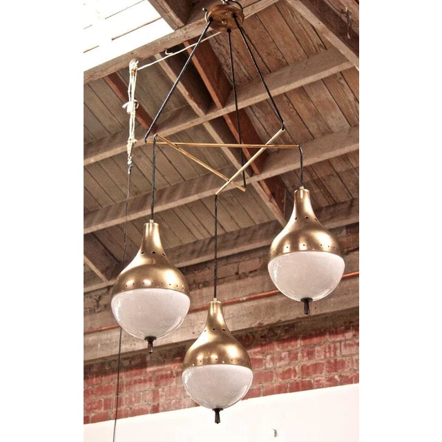 Cascading globes of light. Three's not a crowd in this one.