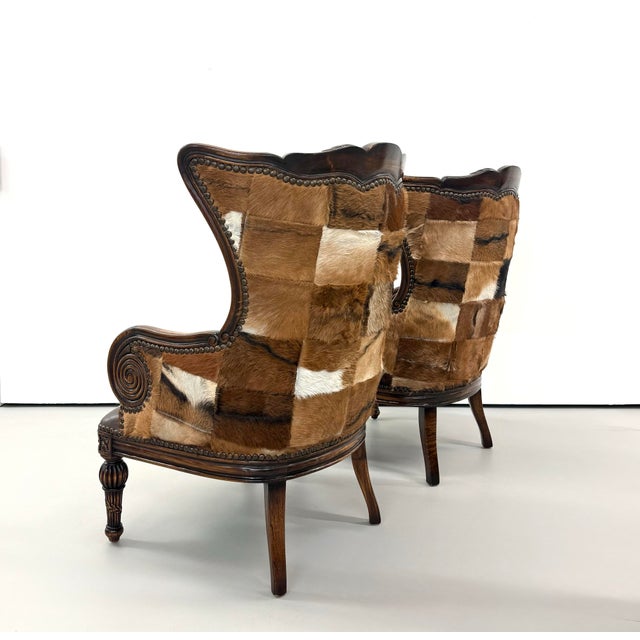 Vintage Carved Wood Patchwork Cowhide Wingback Chairs - Pair For Sale - Image 4 of 9