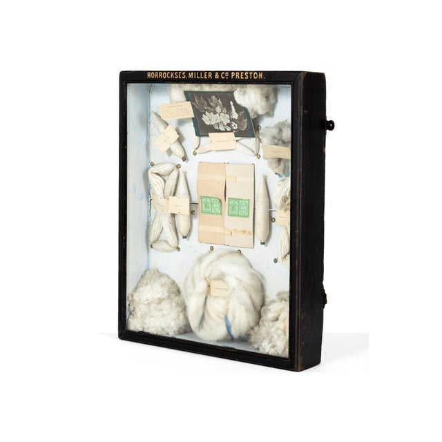A charming late 19th century wool sampler display case by horrockses, miller and co. Of lancashire. The glazed ebonised...