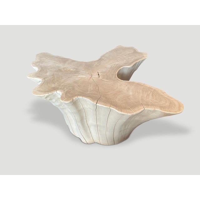 Impressive reclaimed bleached teak amorphous coffee table. A graduation from the bottom to the top. We added a polish to...