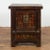 A Chinese Qing Dynasty period bedside cabinet from the 19th century with original lacquer, pair of petite double doors,...