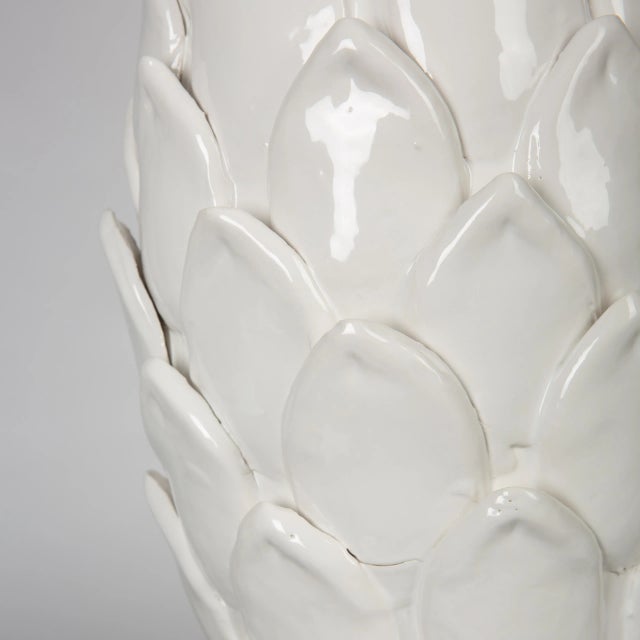 Infuse your living room with the organic elegance of a contemporary ceramic table lamp. Its textured design features an...