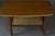 An elegant Scandinavian modern coffee table dating back to the 1960s, meticulously restored in our atelier. The tabletop,...