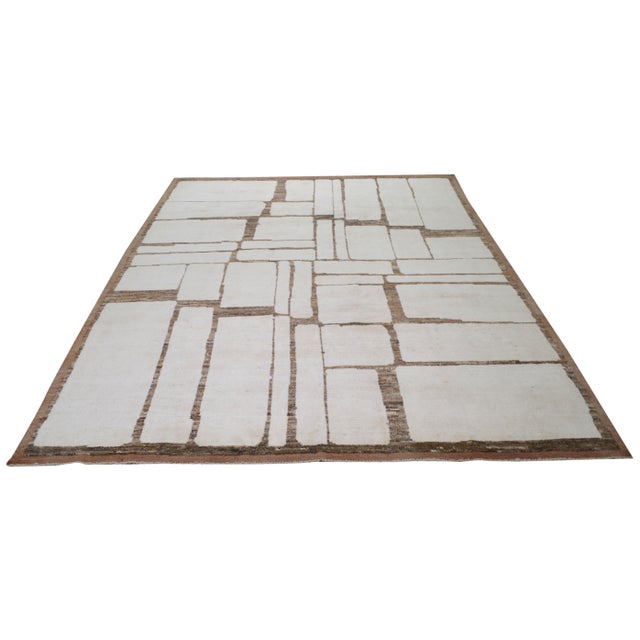 Hand-knotted with care using traditional rug making techniques, this wool rug blends timeless craftsmanship with a modern...