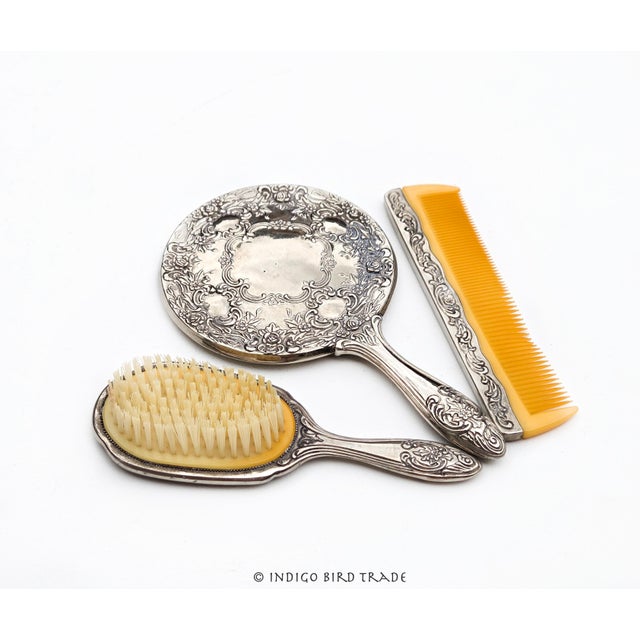 Vintage Silver plated Vanity set of 3: Hand mirror, brush and comb Heavy and well balanced, a lovely silver plated hand...
