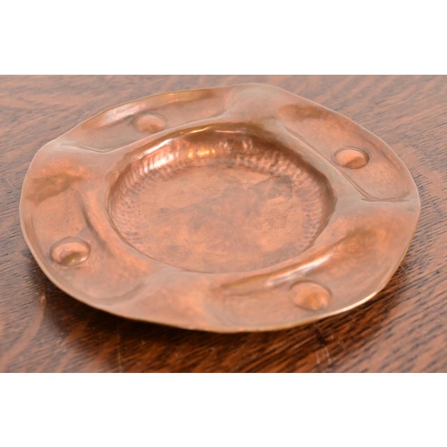 A gorgeous antique Arts & Crafts period hand hammered copper ashtray or catchall By Gustav Stickley (signed to the...