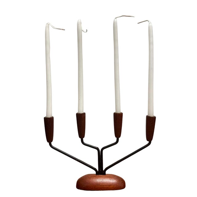 A beautifully crafted vintage Danish Modern candelabra featuring a sculptural combination of solid teak and black metal....