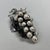 This refined sculpture captures the essence of nature through a meticulous depiction of a bunch of grapes, where the...