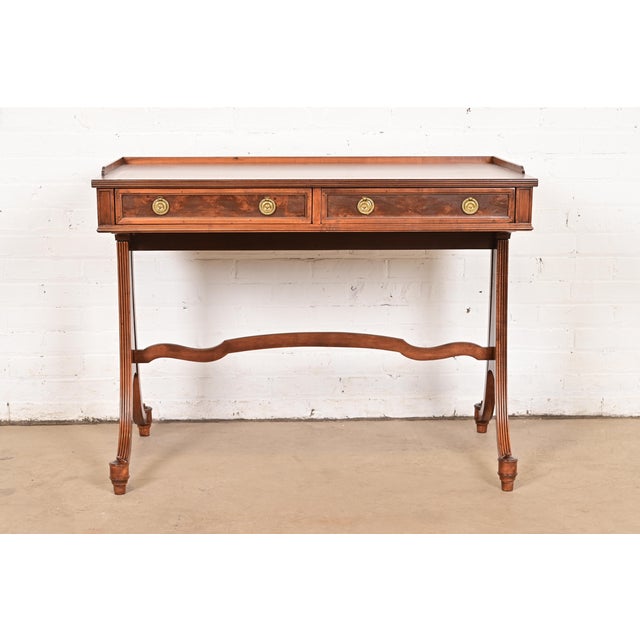 An exceptional English Regency or Georgian style writing desk, console table, or sofa table By Baker Furniture USA, Circa...