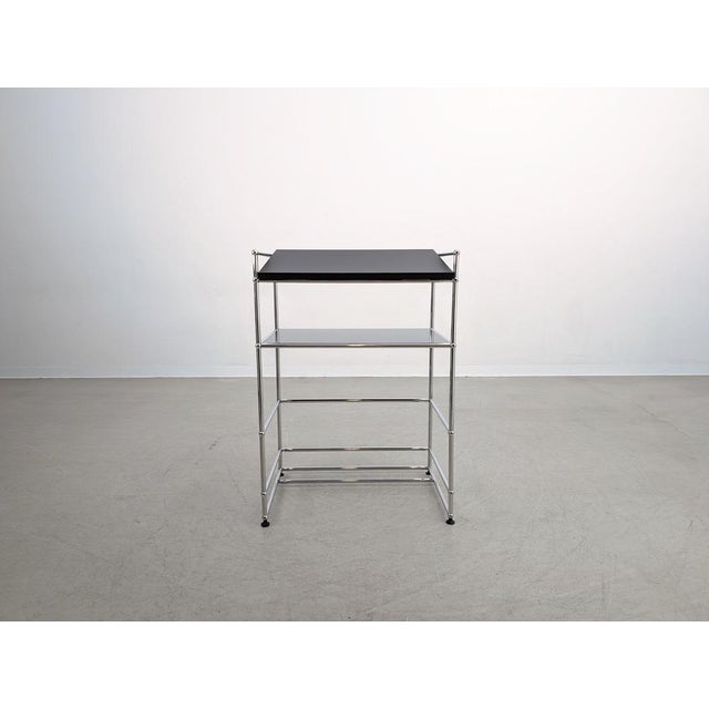 Beautiful lectern by USM Haller. The piece features a shelf, providing ample storage space for notes or technical...