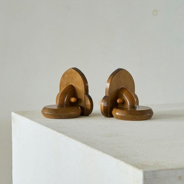Elegant Pair of Art Deco Bookends in Wood 1930s. A very handsome pair of art deco bookends in lacquered wood. Beautiful...
