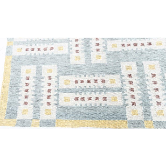 This contemporary Swedish flat-weave rug is a celebration of Scandinavian design principles-simplicity, balance, and...