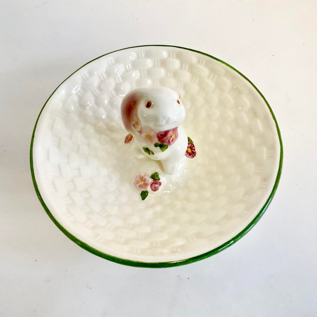 This is an adorable vintage trinket dish with a whimsical bunny figurine in the center. The dish is a faux basket weave in...