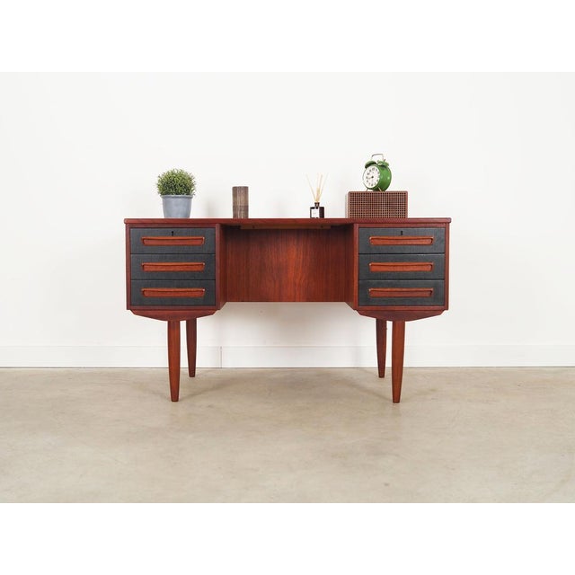 The desk was made in the 1970s, produced by the well-known Danish manufactory A.P. Møbler Svenstrup. The structure and the...