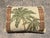 Vintage woven tapestry throw pillow featuring a tropical palm tree motif framed by patterned borders. Features a central...
